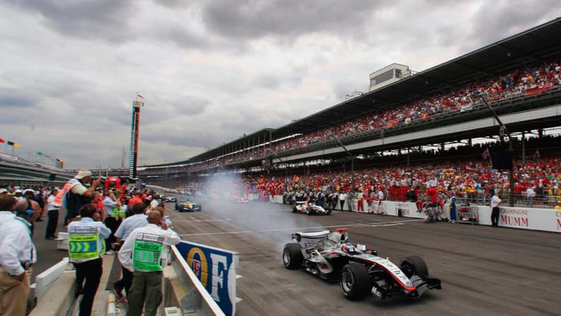 Kimi Raikkonen (McLaren-Mercedes) leads the field off the grid on the warm-up lap before the 2005 United States Grand Prix in Indianapolis. Photo: Grand Prix Photo