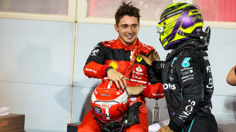 Lewis Hamilton congratulates charles Leclerc after the 2022 F1 Bahrain Grand Prix
