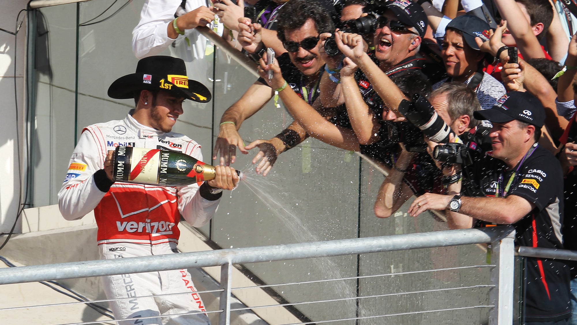 Lewis-Hamilton-sprays-champagne-at-US-GP