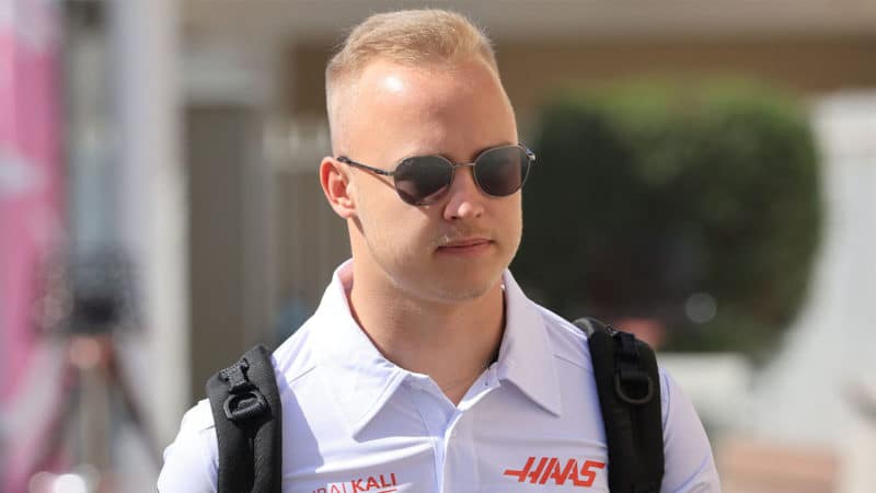 Haas' Russian driver Nikita Mazepin arrives at the track ahead of the practice session of the Abu Dhabi Formula One Grand Prix at the Yas Marina Circuit in the Emirati city of Abu Dhabi on December 9, 2021. (Photo by Giuseppe CACACE / AFP) (Photo by GIUSEPPE CACACE/AFP via Getty Images)