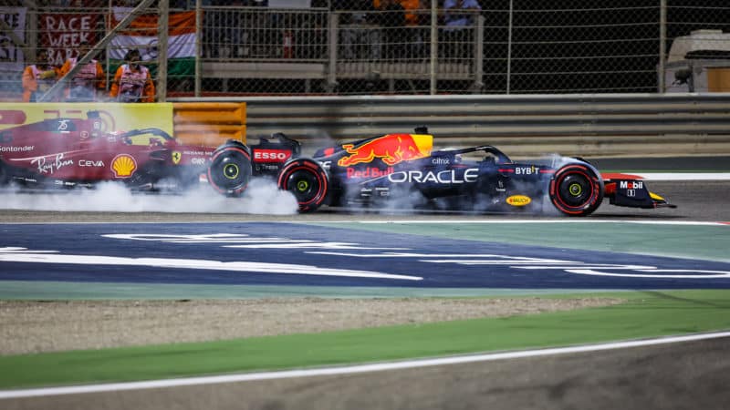 Max Verstappen locks up as he tries to paass Charles Leclerc at the 2022 F1 Bahrain Grand Prix