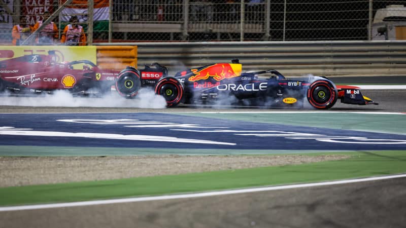 Max Verstappen locks up as he passes Charles Leclerc in the 2022 Bahrain Grand Prix