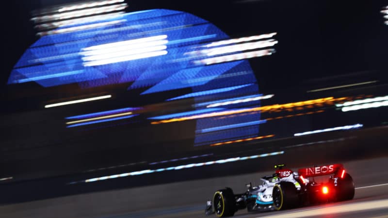 Mercedes of George Russell speeds past lights at the 2022 Bahrain Grand Prix