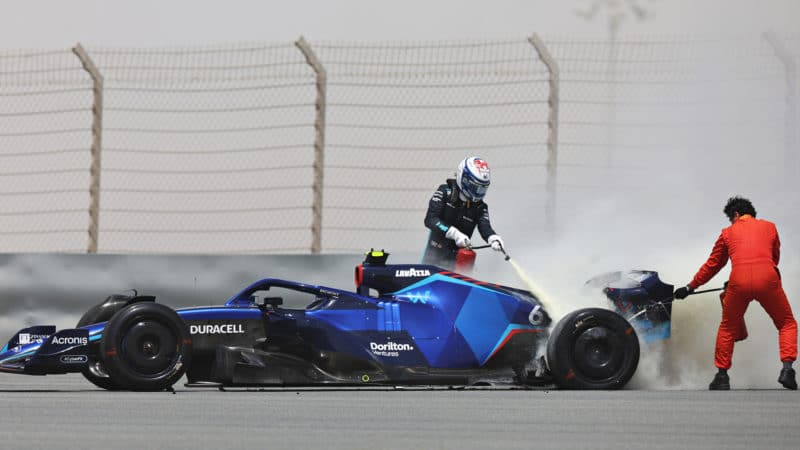 Nicholas Latifi helps extinguish fire on his Willaims at 2022 F1 Bahrain testing
