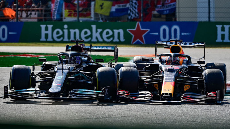 Red Bull's Dutch driver Max Verstappen (R) and Mercedes' British driver Lewis Hamilton collide during the Italian Formula One Grand Prix at the Autodromo Nazionale circuit in Monza, on September 12, 2021. (Photo by ANDREJ ISAKOVIC / AFP) (Photo by ANDREJ ISAKOVIC/AFP via Getty Images)