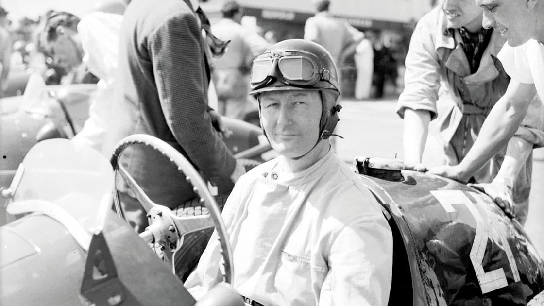 24th July 1952: British racing driver Peter Whitehead (1914 - 1958) in his car at Silverstone. (Photo by Stroud/Express/Getty Images)