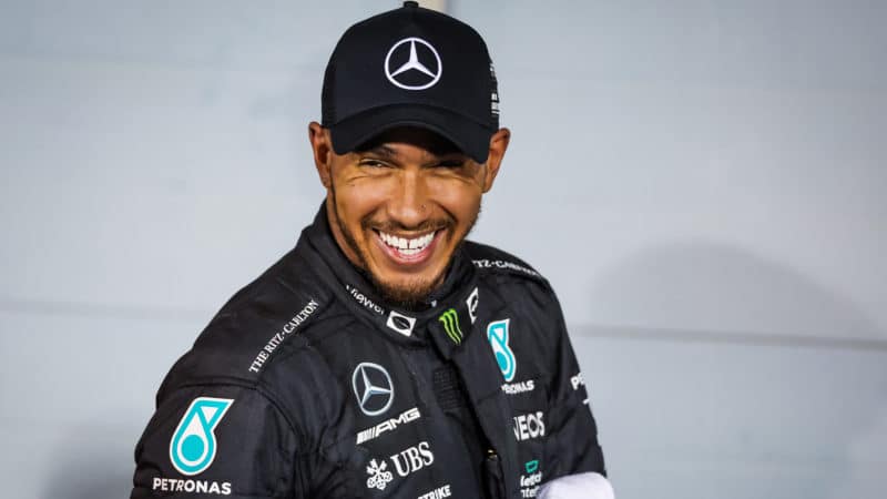 Lewis Hamilton smiles after finishing on the podium at the 2022 F1 Bahrain Grand Prix