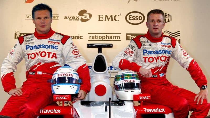 TOKYO - OCTOBER 9: Mika Salo (left) of Finland and Allan McNish of Scotland sit on a Toyota Formula One racing car during a press conference October 9, 2002 in Tokyo, Japan. The Japanese Grand Prix will be held on October 13, 2002 and is the final race of the 2002 Formula One World Championship Season. (Photo by Koichi Kamoshida/Getty Images)