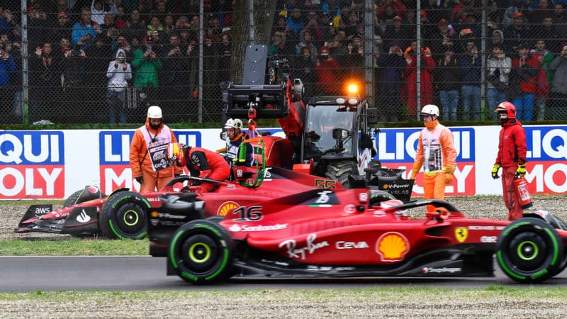 Charles Leclerc drives past stranded Carlos Sainz in the 2022 Emilia Romagna GP