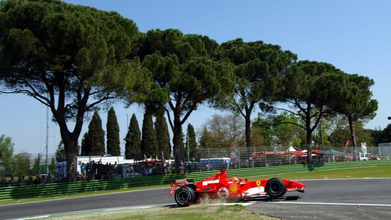 Front wheel of Michael Schumachers Ferrari is raised in the air mid-corner at Imola