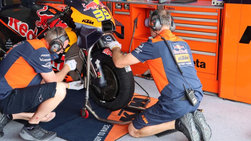 KTM mechanics remove fender to change front brake caliper