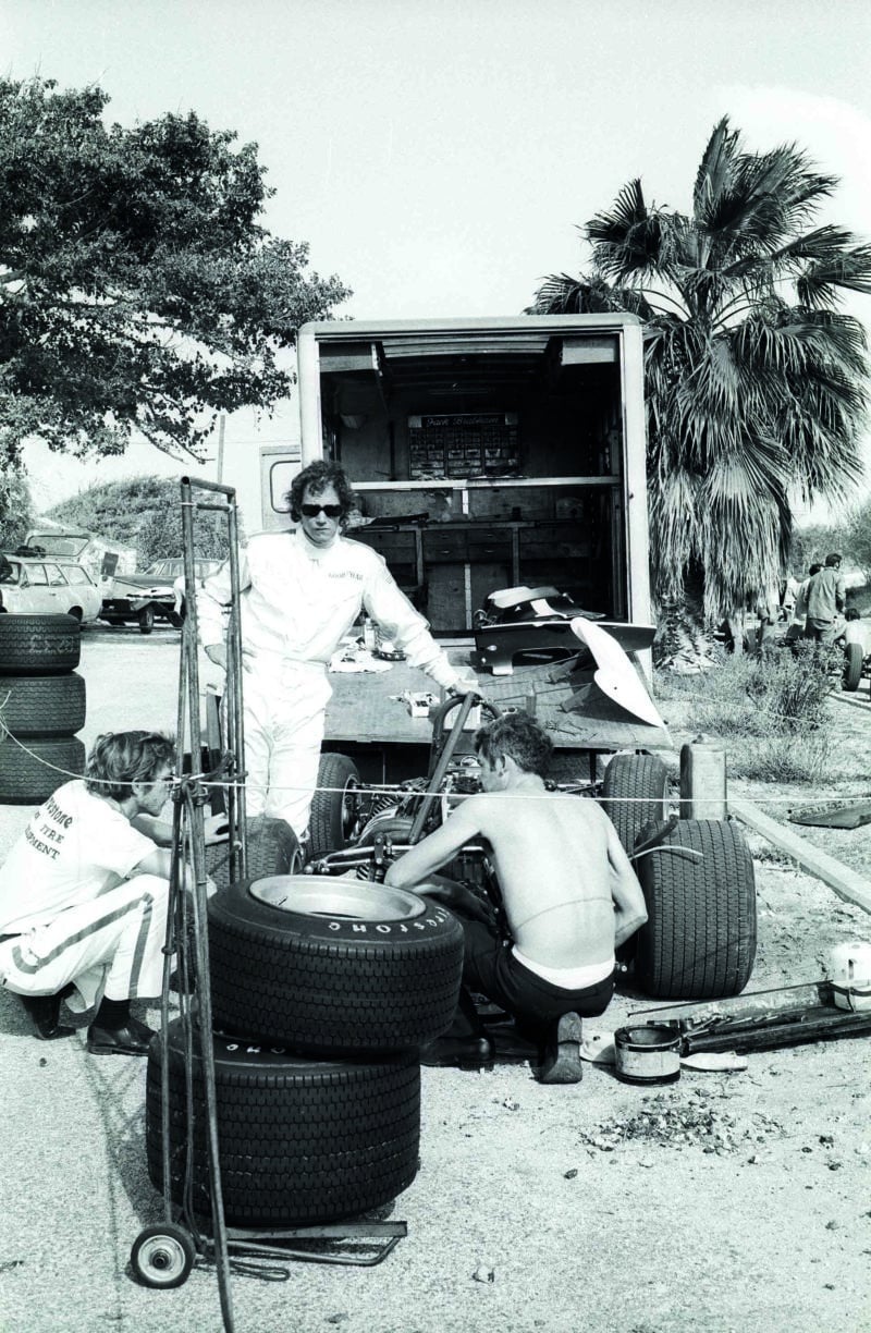 Mechanics work on F2 car at the back of a trailer at the 1970 Israel Grand Prix