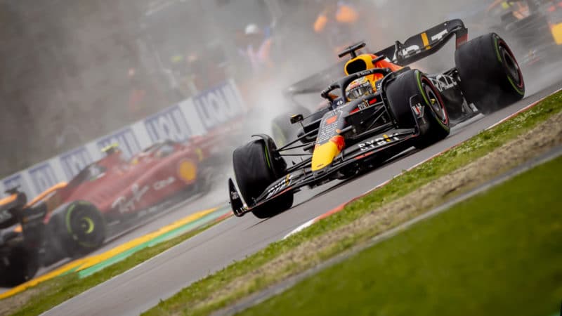 Max Verstappen leads the 2022 Emilia Romagna GP as Carlos Sainz spins in background