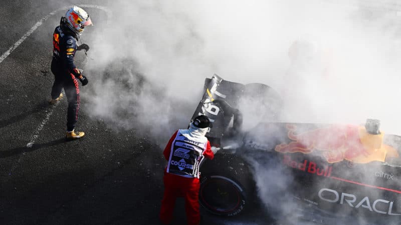 Max Verstappen watches smoke pouring from his Red Bull at the 2022 Australian Grand Prix