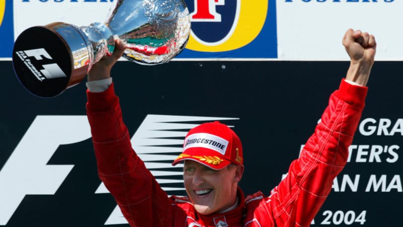 Michael Schumacher celebrates winning the 2004 San Marino Grand Prix