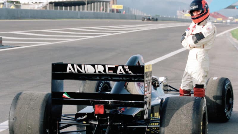 Perry McCarthy with stopped Andrea Moda car