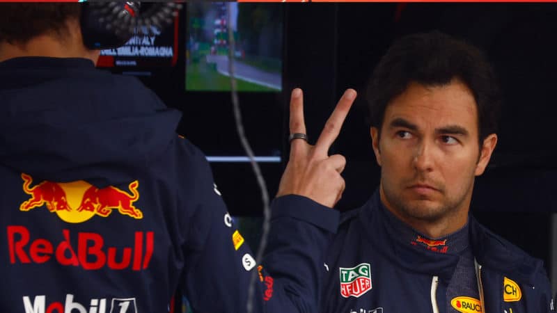 Red Bull engineer holds up two fingers to Sergio Perez at the 2022 Emilia Romagna GP