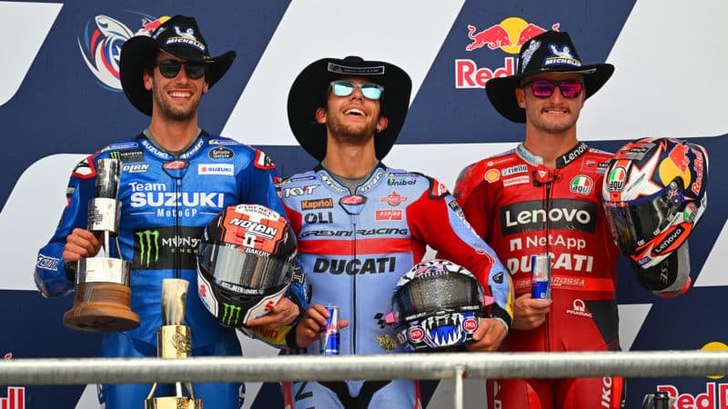 Rins Bastianini and Miller on the podium after the 2022 MotoGP Americas GP