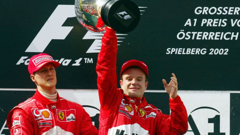 Rubens Barrichello on the podium with Michael Schumacher at the 2002 Austrian Grand Prix