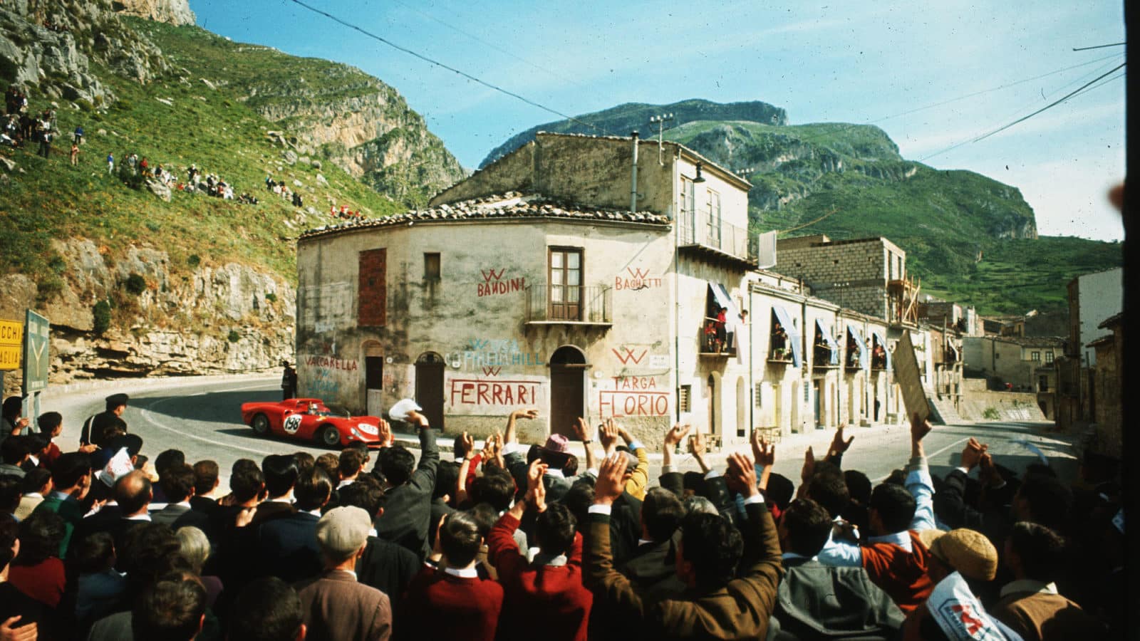 Crowds watch competitors in the 1965 Targa Florio as they race through the Sicilian village of Collesano. (Photo by David Lees/Corbis/VCG via Getty Images)