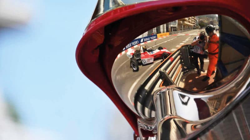 1970s Ferrari reflectd in marshal's helmet at the 2022 Monaco Historic Grand Prix