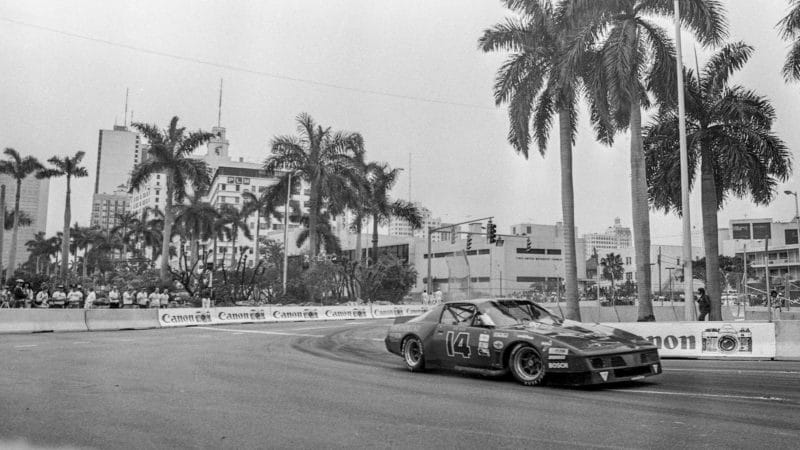 MIAMI, FL - FEBRUARY 27: The #14 Pontiac Firebird of Bob Raub races on the track past palm trees during the Budweiser Grand Prix of Miami, IMSA Camel GT race, Bicentennial Park on February 27, 1983 in Miami, Florida. (Photo by Brian Cleary/Getty Images)