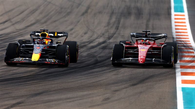 MIAMI, FLORIDA - MAY 08: Max Verstappen of the Netherlands driving the (1) Oracle Red Bull Racing RB18 and Charles Leclerc of Monaco driving (16) the Ferrari F1-75 compete for position on track during the F1 Grand Prix of Miami at the Miami International Autodrome on May 08, 2022 in Miami, Florida. (Photo by Mark Thompson/Getty Images)