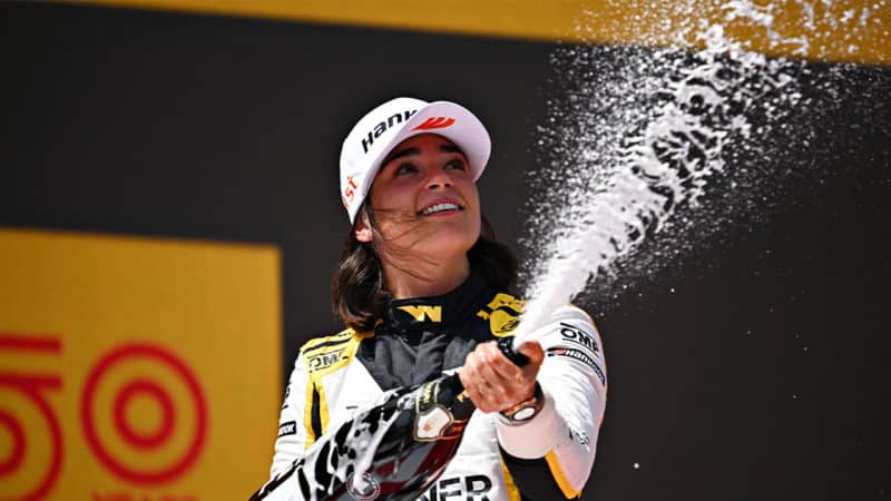 BARCELONA, SPAIN - MAY 21: Race winner Jamie Chadwick of Great Britain and Jenner Racing (55) celebrates on the podium during the W Series Round 2 race at Circuit de Barcelona-Catalunya on May 21, 2022 in Barcelona, Spain. (Photo by Clive Mason/Getty Images)