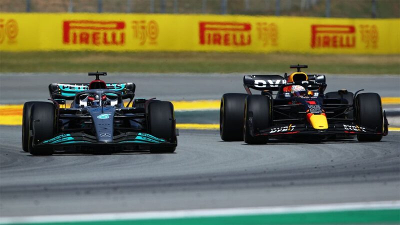 BARCELONA, SPAIN - MAY 22: George Russell of Great Britain driving the (63) Mercedes AMG Petronas F1 Team W13 and Max Verstappen of the Netherlands driving the (1) Oracle Red Bull Racing RB18 battle for track position during the F1 Grand Prix of Spain at Circuit de Barcelona-Catalunya on May 22, 2022 in Barcelona, Spain. (Photo by Joe Portlock - Formula 1/Formula 1 via Getty Images)