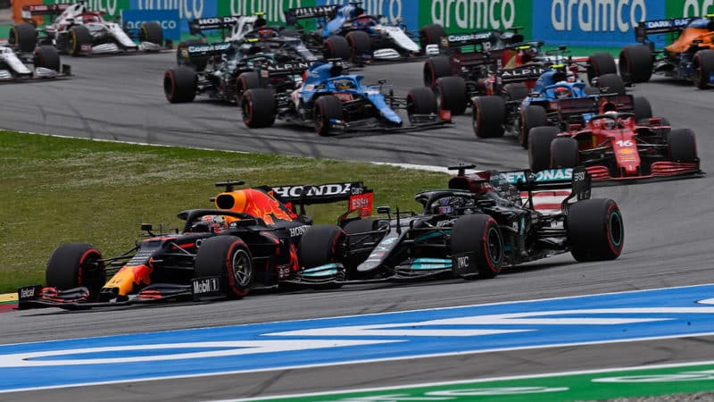 Lewis Hamilton (Mercedes) and Max Verstappen (Red Bull-Honda) lead at the start of the 2021 Spanish Grand Prix at the Circuit de Barcelona-Catalunya. Photo: Grand Prix Photo