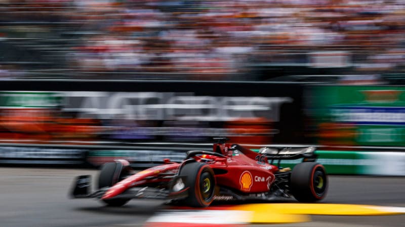 Blurred image of Charles LEclerc going over a kerb in qualifying for the 2022 Monaco Grand Prix