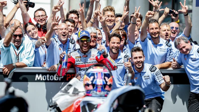 Enea Bastianini celebrates with team after winning the 2022 MotoGP French Grand Prix
