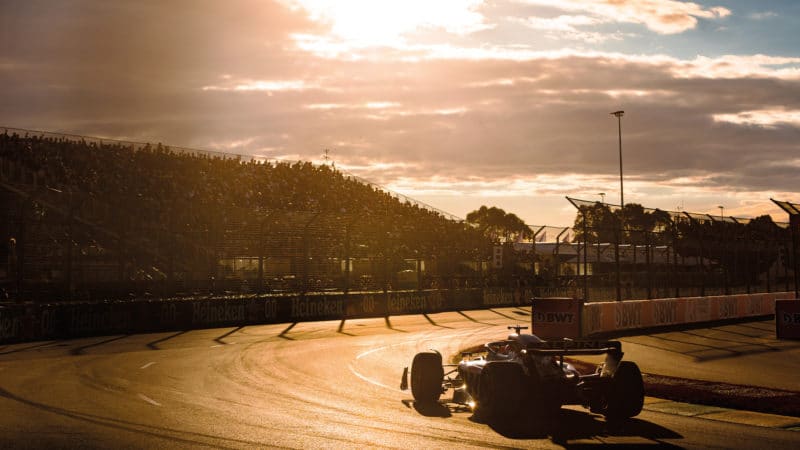 Fernando Alonso drives into the setting sun at the Australian Grand Prix