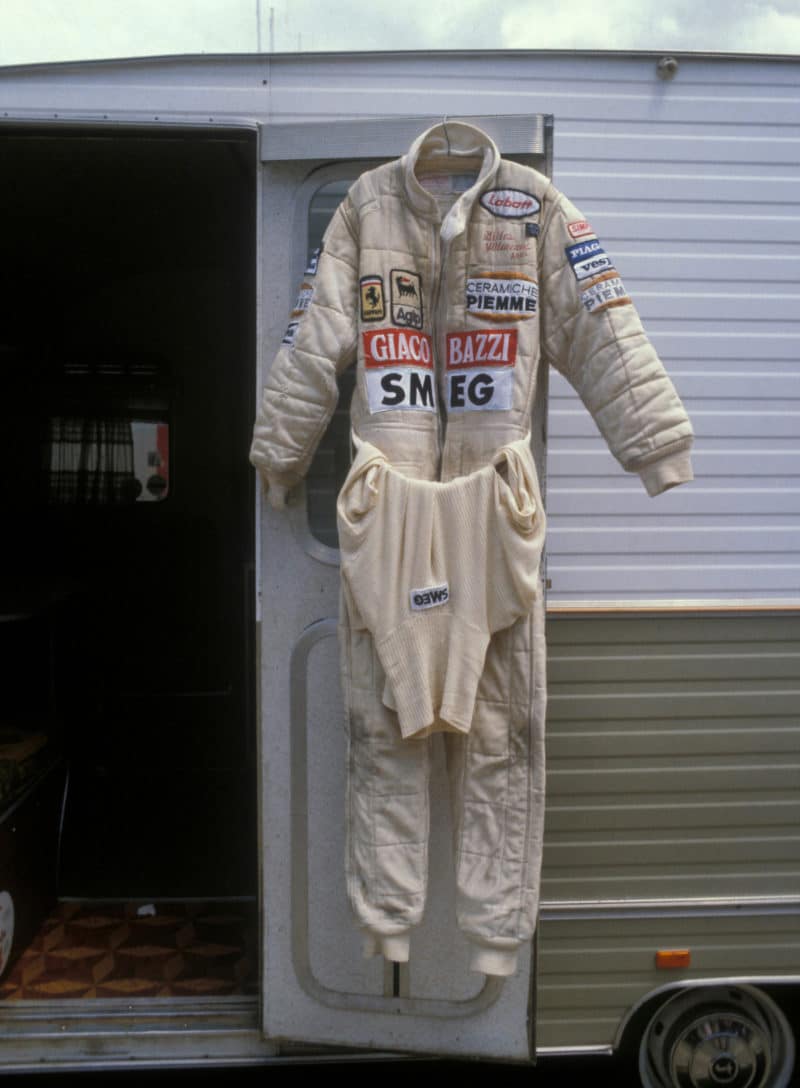 Gilles-Villeneuve-overalls-hanging-on-caravan-door.