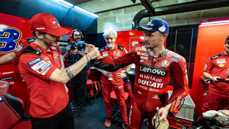 Jack shakes hands with Pecco Bagnaia in Ducati pit at 2022 Le Mans MotoGP race