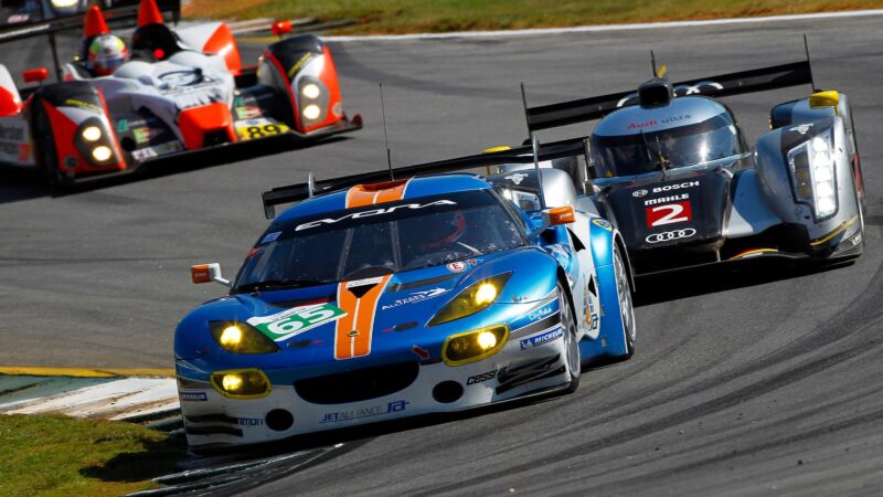 Lotus Evora GT4 ahead of Audi R18 in 2011 Petit Le Mans