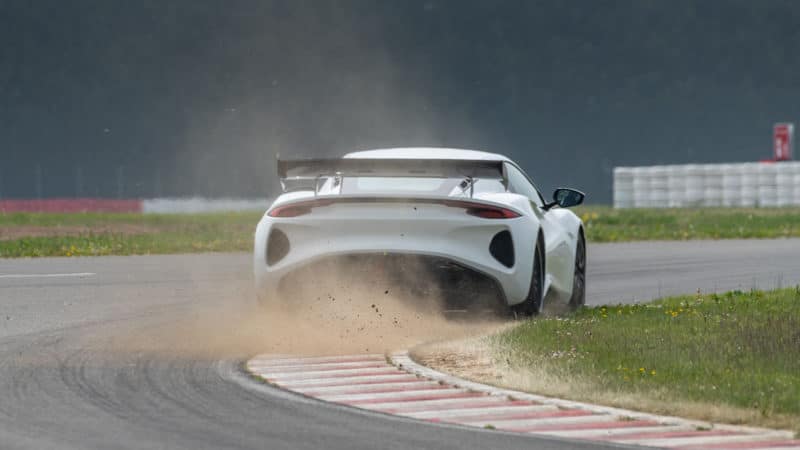 Lotus Emira GT4 kicks up dust at Hethel test track