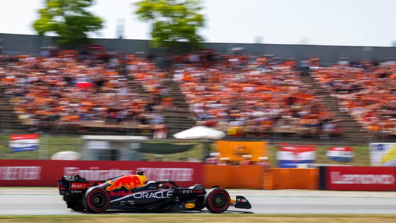 Max Verstappen drives past orange-clothed fans at the 2022 Spanish Grand Prix