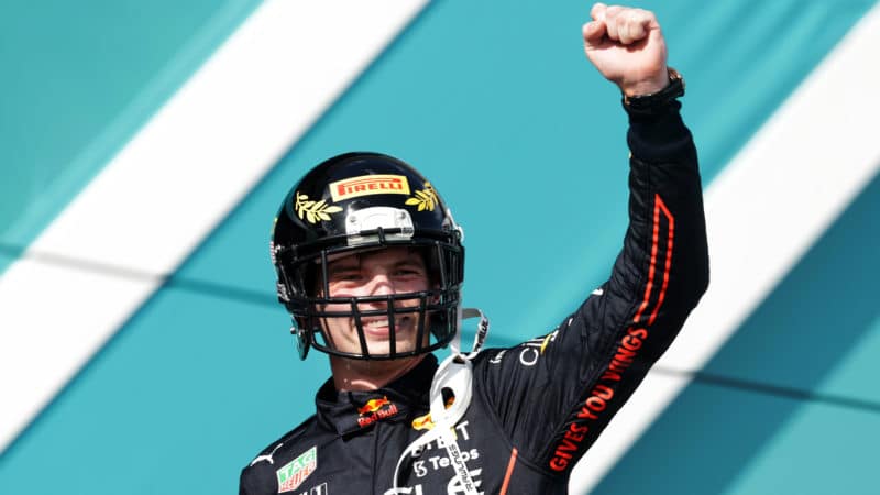 Max Verstappen wearing NFL helmet on the podium at the 2022 Miami Grand Prix