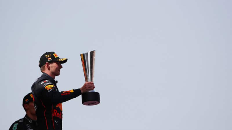 Max Verstappen with the winning trophy on the podium at the 2022 Spanish Grand Prix