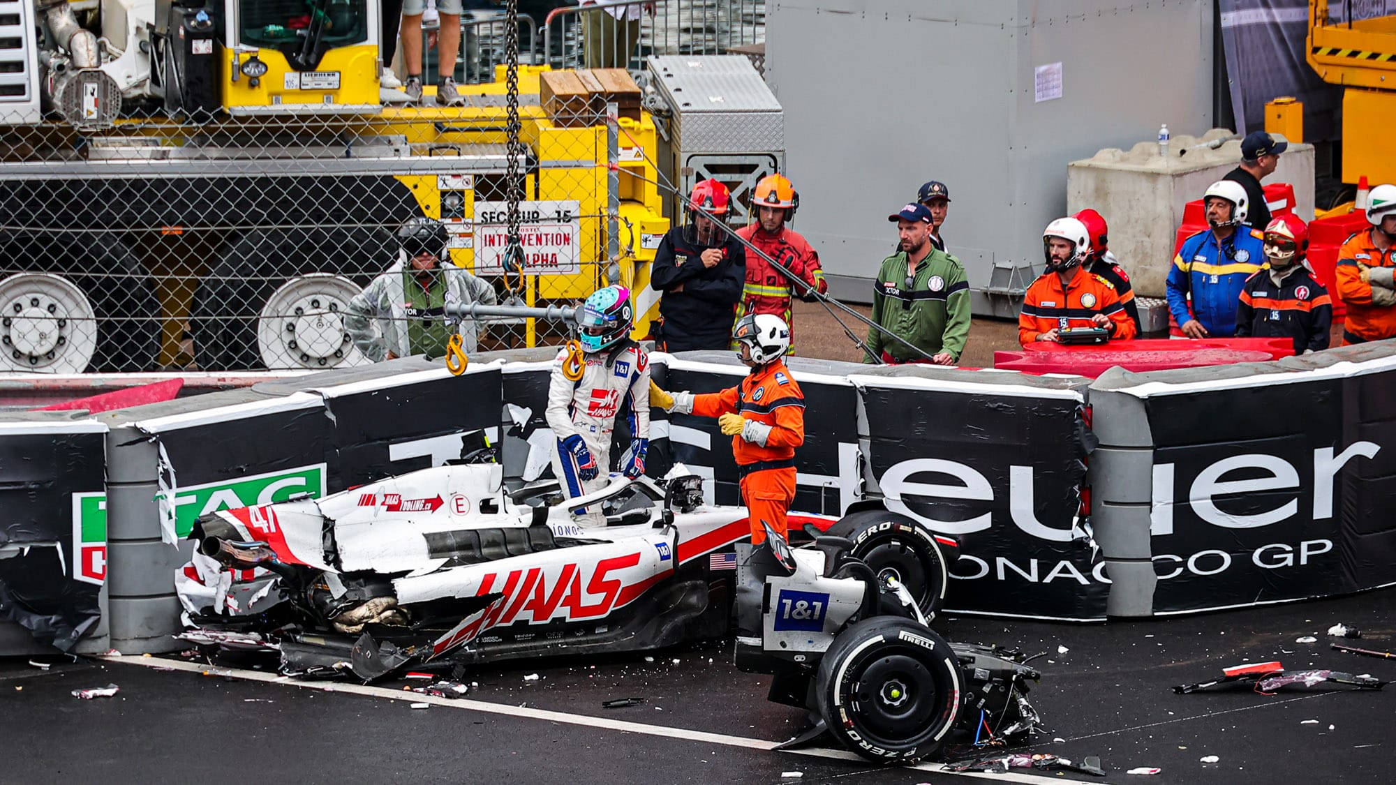 Mick Schumacher gets out of the wreckage of his F1 Haas at the 2022 Monaco Grand Prix