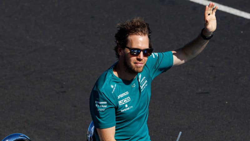 Sebastian Vettel waves from a car during the 2022 Australian GP drivers parade