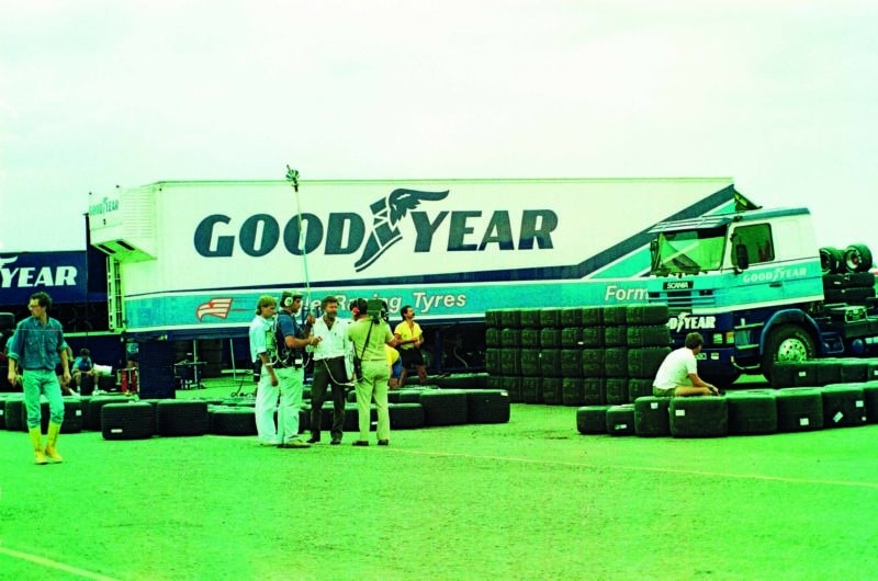 TV crew in front of tyres and Goodyear truck at the 1987 British Grand Prix