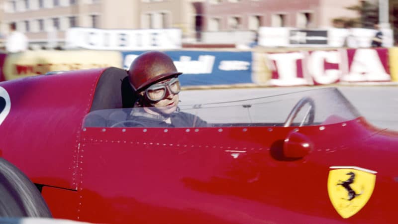 Tony Brooks looks concentrated as he races his Ferrari at the Monaco Grand Prix