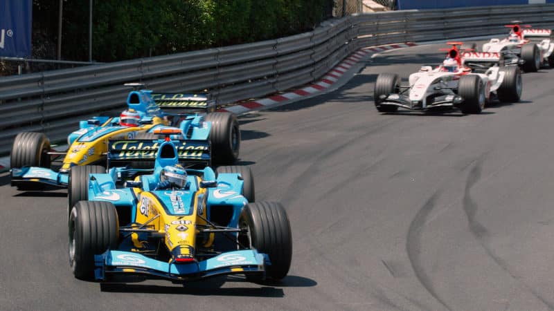 Jarno Trulli leads Renault team-mate Fernando Alonso and BAR-Honda drivers Jenson Button and Takuma Sato into thr Loews hairpin on the first lap of the 2004 Monaco Grand Prix. Photo: Grand Prix Photo