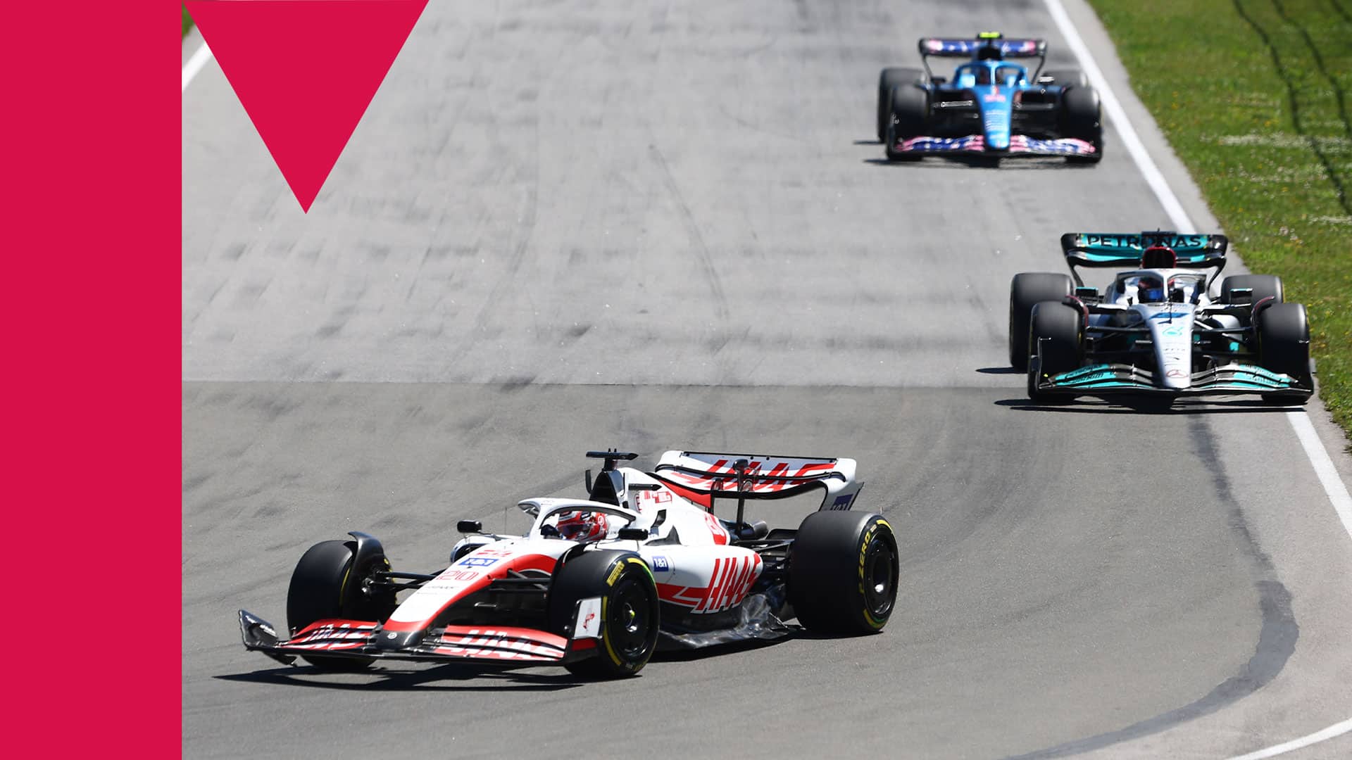 MONTREAL, QUEBEC - JUNE 19: Kevin Magnussen of Denmark driving the (20) Haas F1 VF-22 Ferrari leads George Russell of Great Britain driving the (63) Mercedes AMG Petronas F1 Team W13 during the F1 Grand Prix of Canada at Circuit Gilles Villeneuve on June 19, 2022 in Montreal, Quebec.  (Photo by Clive Rose/Getty Images)