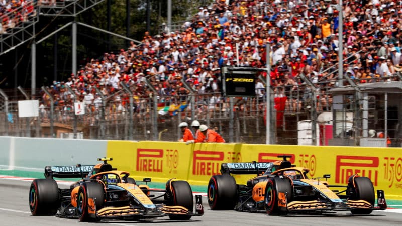 Lando Norris McLaren F1 driver at the 2022 Spanish GP overtaking team-mnte Daniel Ricciardo