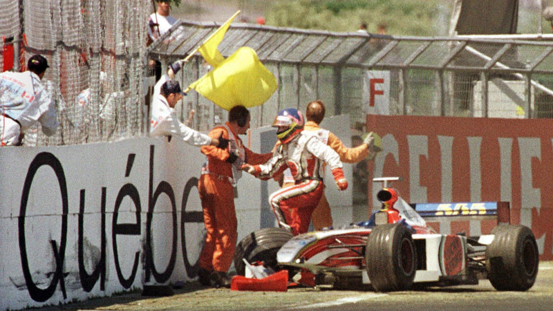 MONTREAL, CANADA: Canadian F-1 driver Jacques Villeneuve jumps out of his car after crashing at the Circuit Gilles Villeneuve during the Canadian Grand Prix in Montreal 13 June, 1999. This is the sixth race in a row this season that Villenueve has not completed. AFP PHOTO/Carlo ALLEGRI (Photo credit should read CARLO ALLEGRI/AFP via Getty Images)