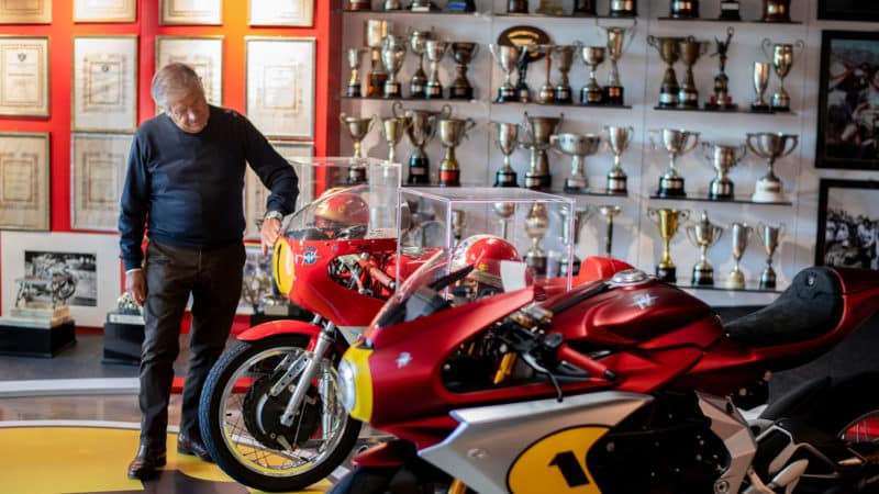 Agostini at his home in Bergamo, Italy, with his trophies, one of his MV Agusta 500s and a brand-new MV Superveloce Ago