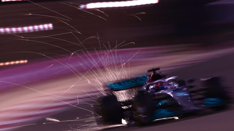 Blurred picture of George russell Mercedes with sparks flying
